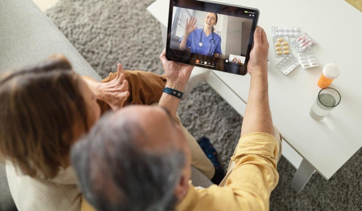 telemedicine services senior spouses having video call with online doctor getting professional